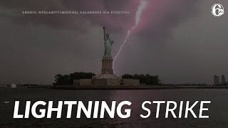 Massive lightning bolt strikes near Statue of Liberty in New York City [upl. by Dylana]