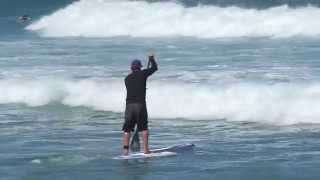 SUP Surf Instruction  How to Paddle Through Breaking Waves [upl. by Enelrihs]