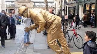 Golden man London street performer floating and levitating trick Covent Gardens [upl. by Young752]